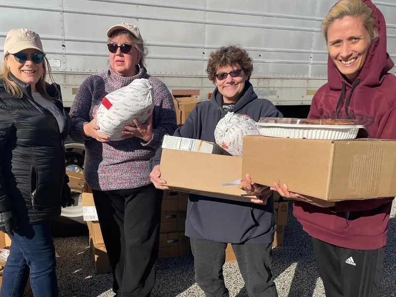 Volunteers Donating Turkeys for the Holidays